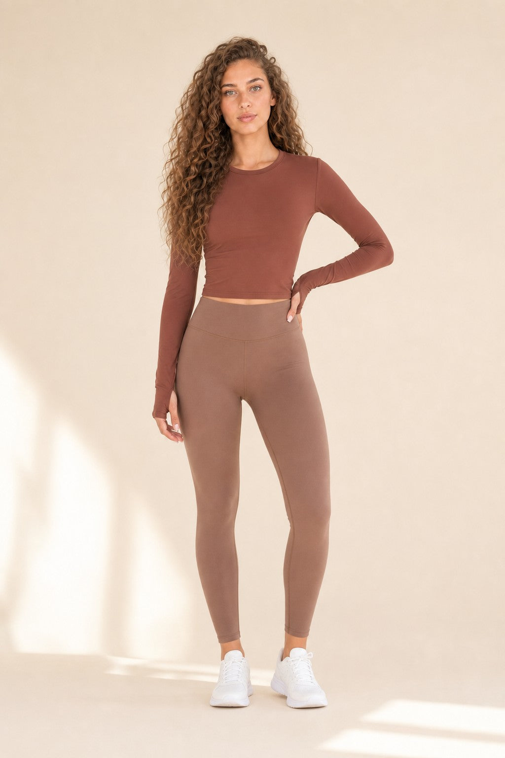 Model wearing NudeBlend Crew Neck Long Sleeve Top in Clay - front