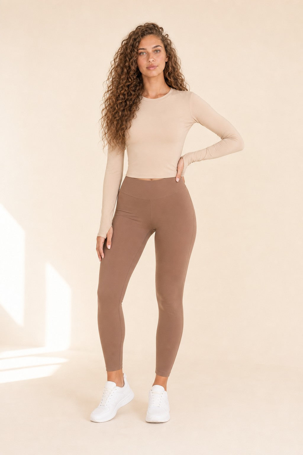 Model wearing NudeBlend Crew Neck Long Sleeve Top in Latte - front