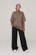 Model wearing NudeBlend Oversized Thumbhole Tee in Mocha - front