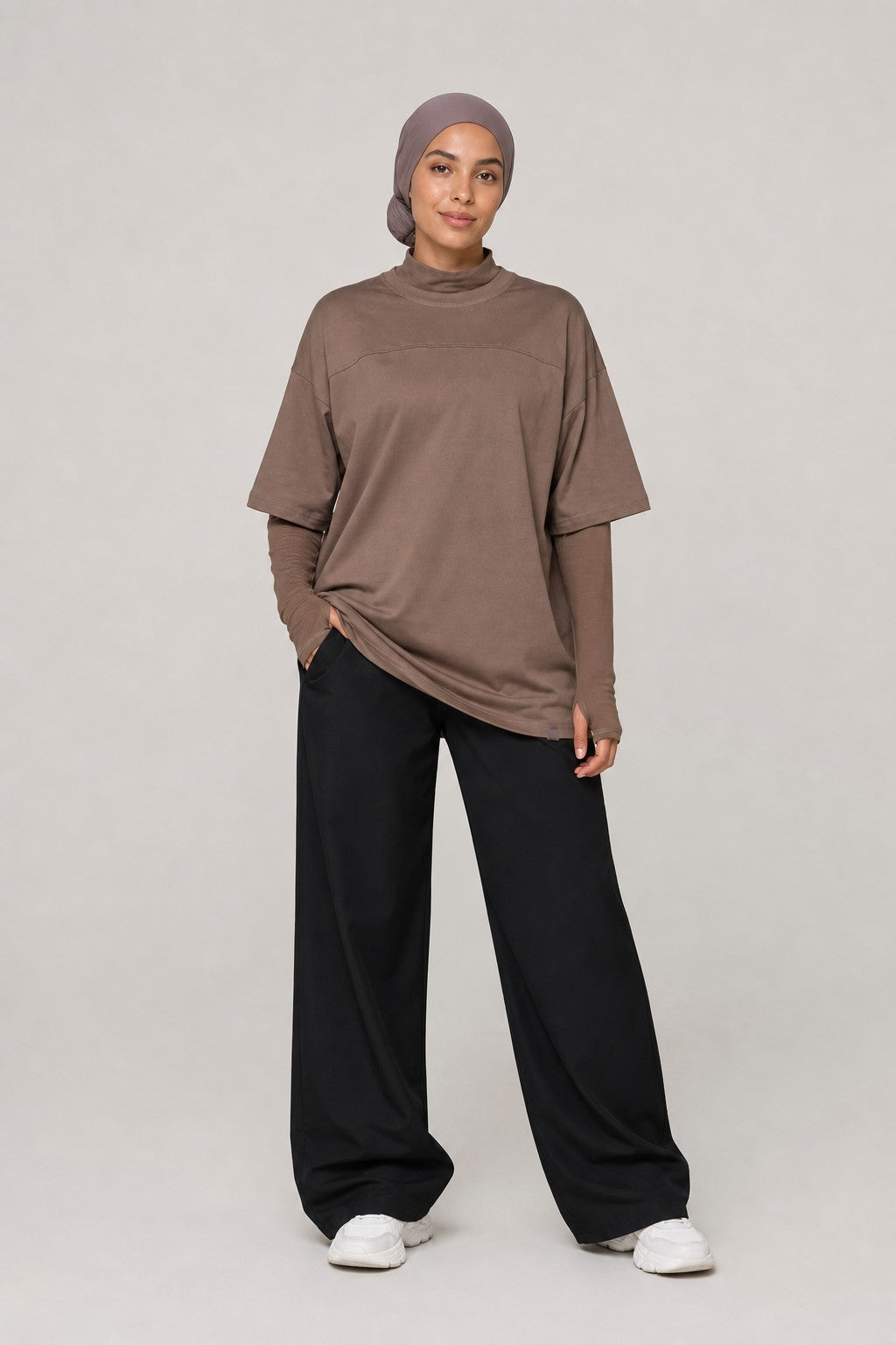 Model wearing NudeBlend Oversized Thumbhole Tee in Mocha - front