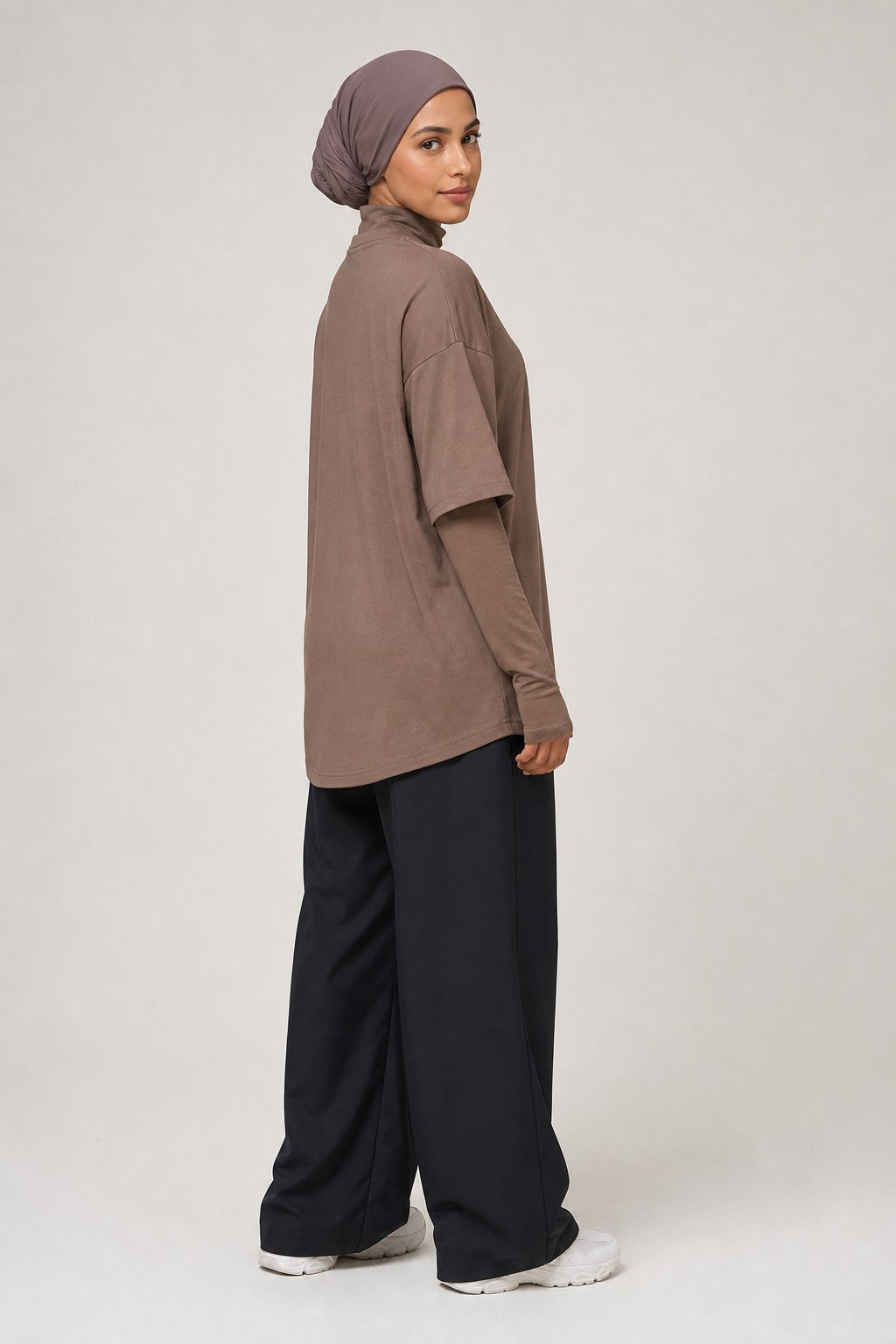 Model wearing NudeBlend Oversized Thumbhole Tee in Mocha - side