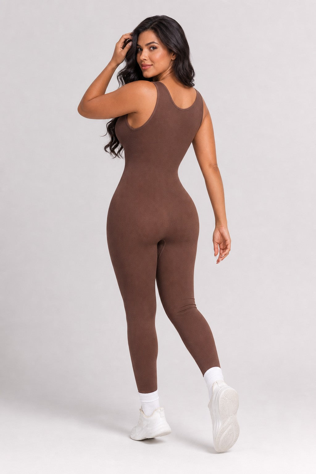 Model wearing NudeBlend Seamless Bodysuit in Espresso - back